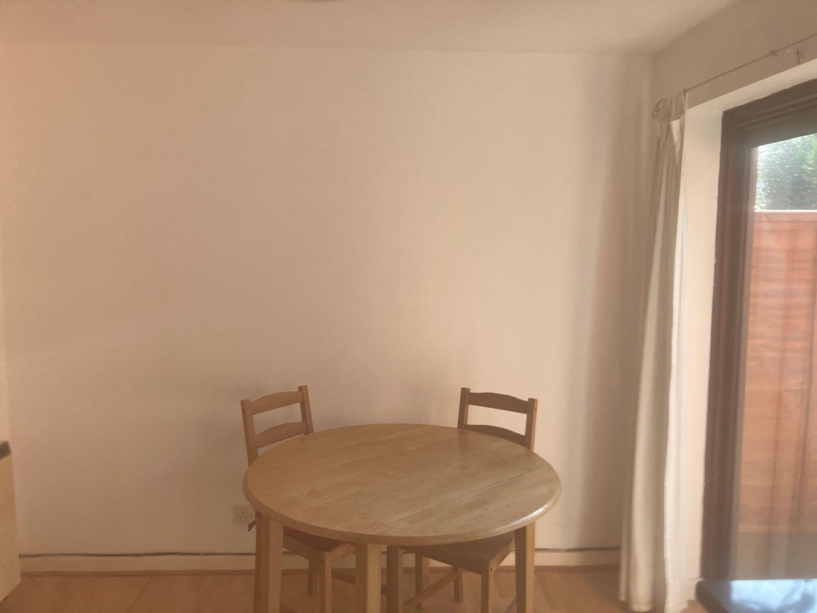 After: dining room wall filled and repainted