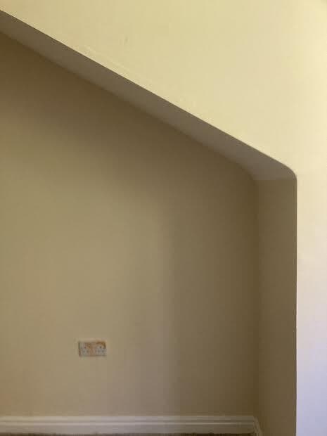 After: the alcove wall painted fresh in cream
