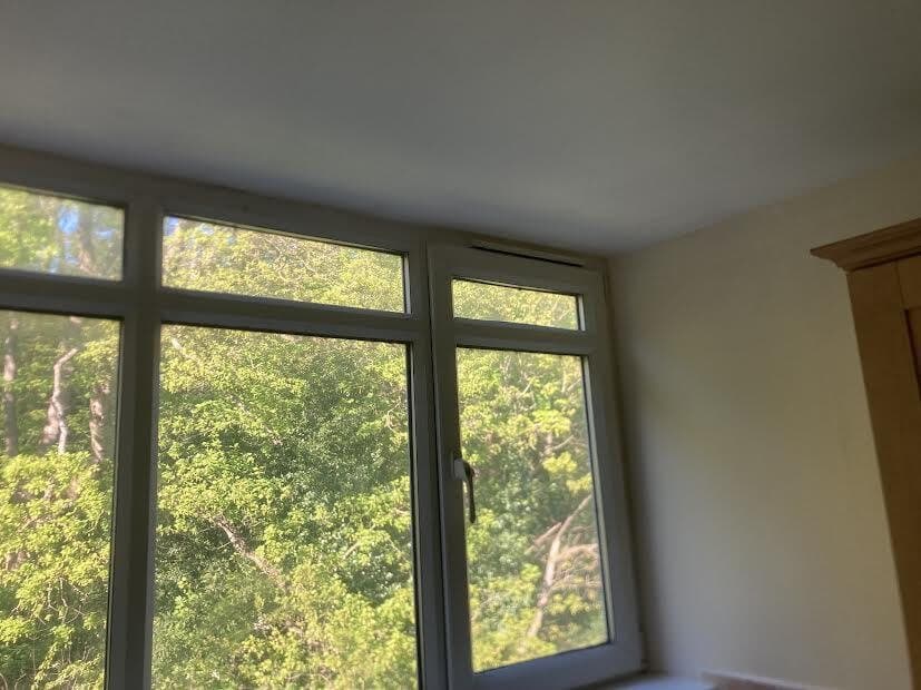 After: ceiling above the bay window painted out clean